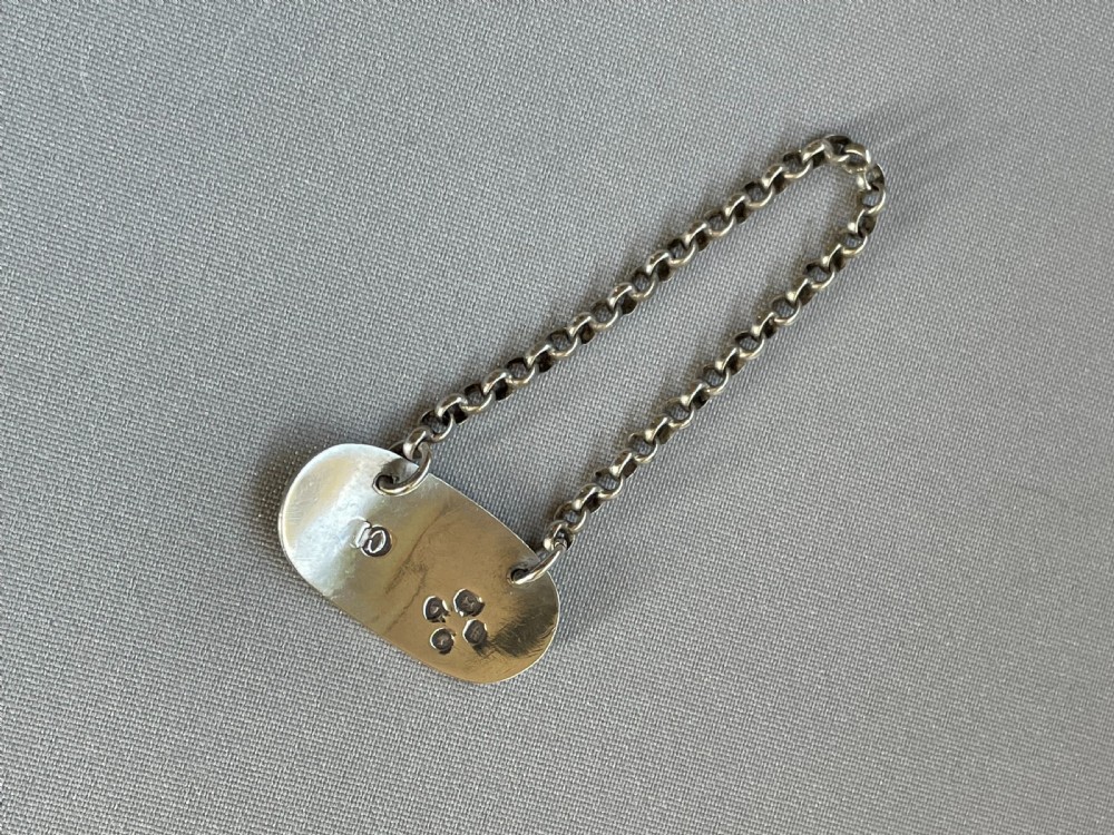 A desirable silver 'Kummell' tot label View III