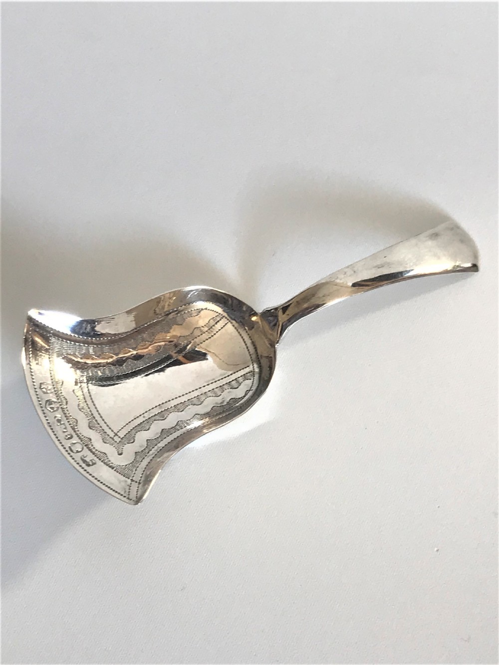 A fine Georgian Regency silver caddy spoon View II