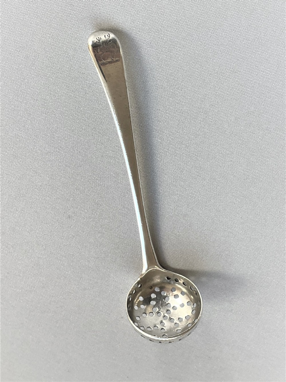 A desirable Georgian silver spice sifting ladle