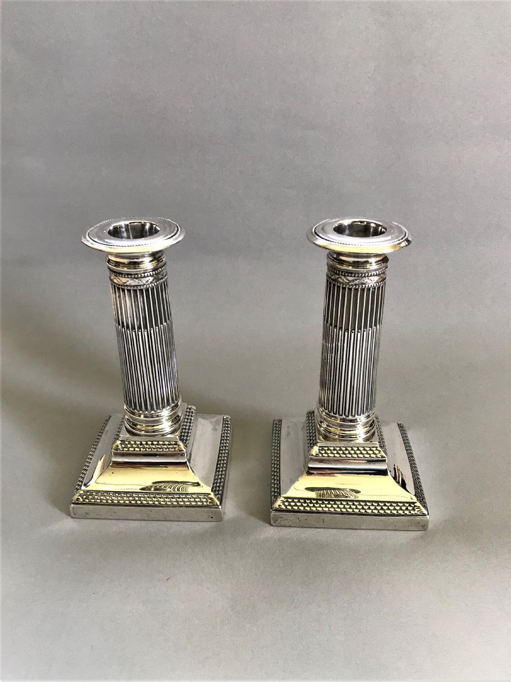 A superb pair of Victorian silver candle sticks View IV