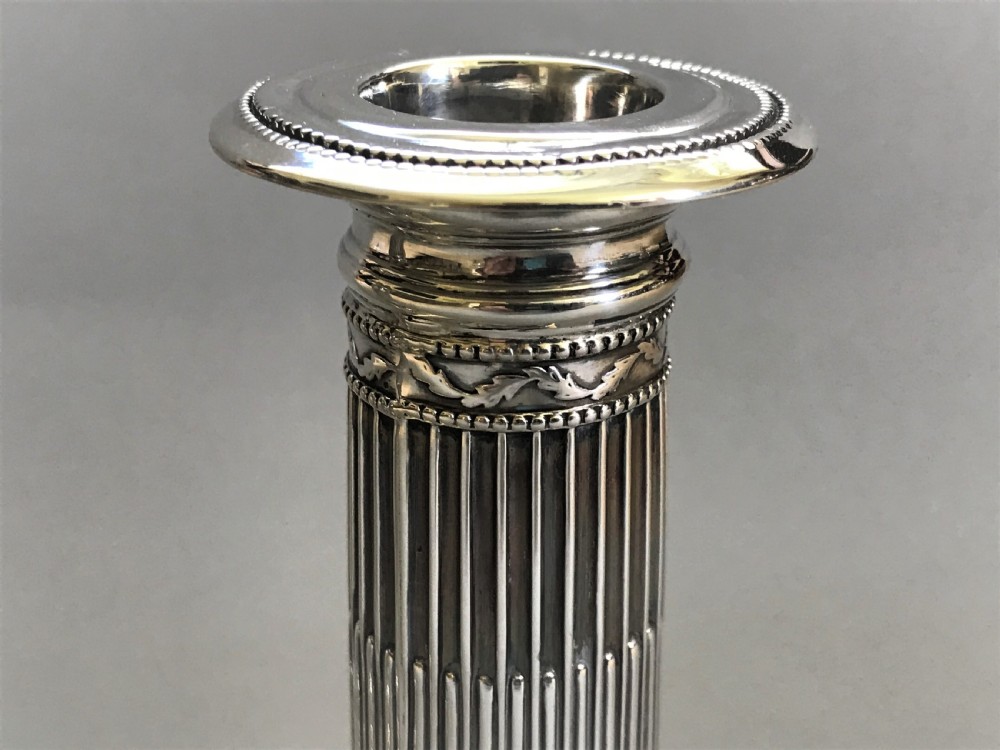 A superb pair of Victorian silver candle sticks View VI