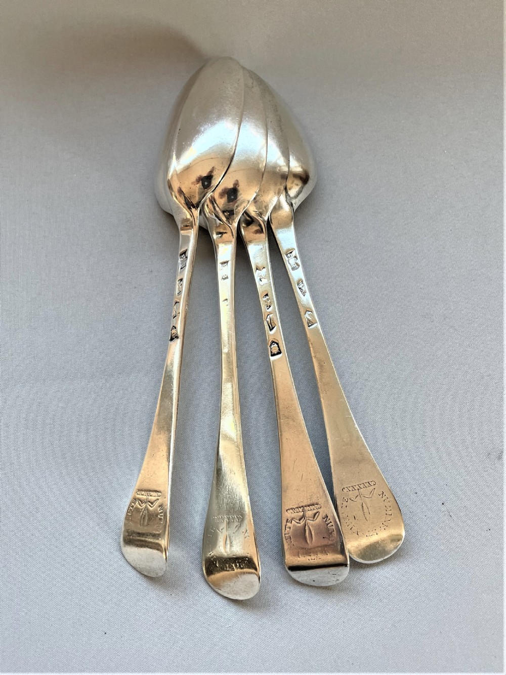 A fabulous set of 4 rat-tail early 18th Century silver table spoons