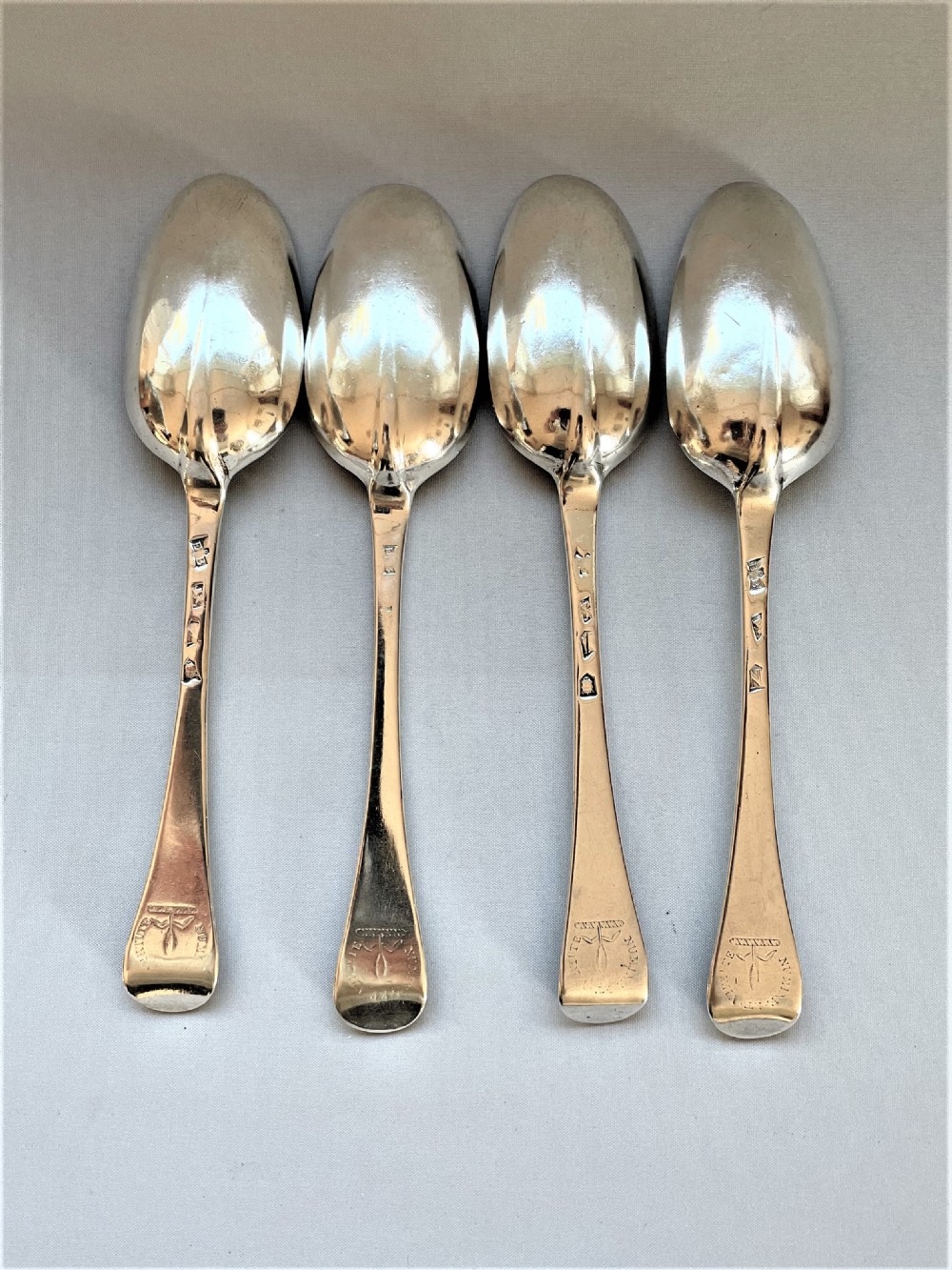 A fabulous set of 4 rat-tail early 18th Century silver table spoons View II