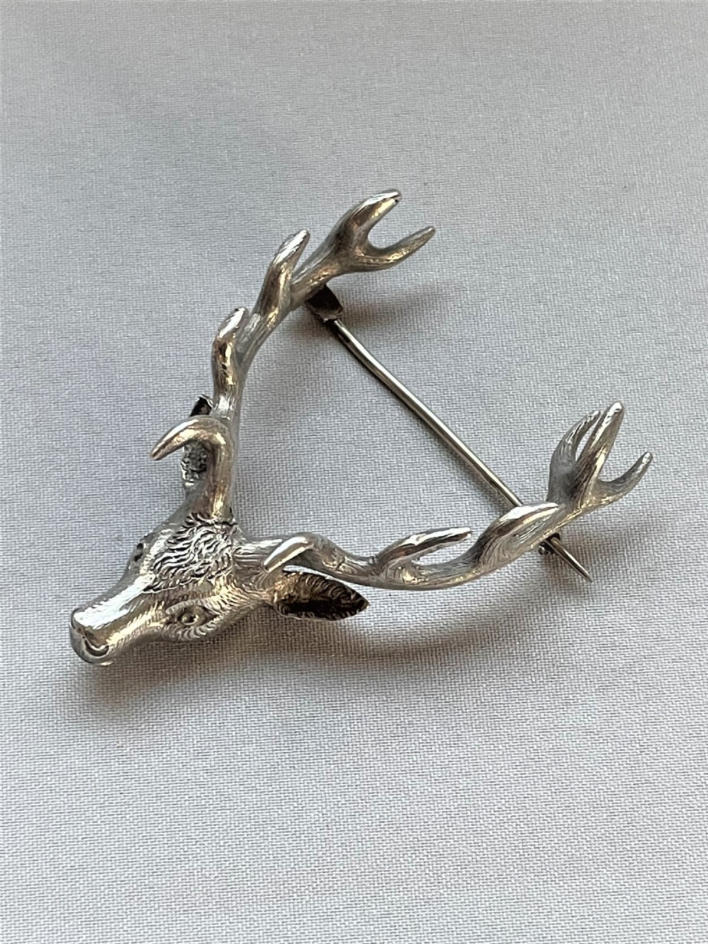 A superb cast silver stag brooch