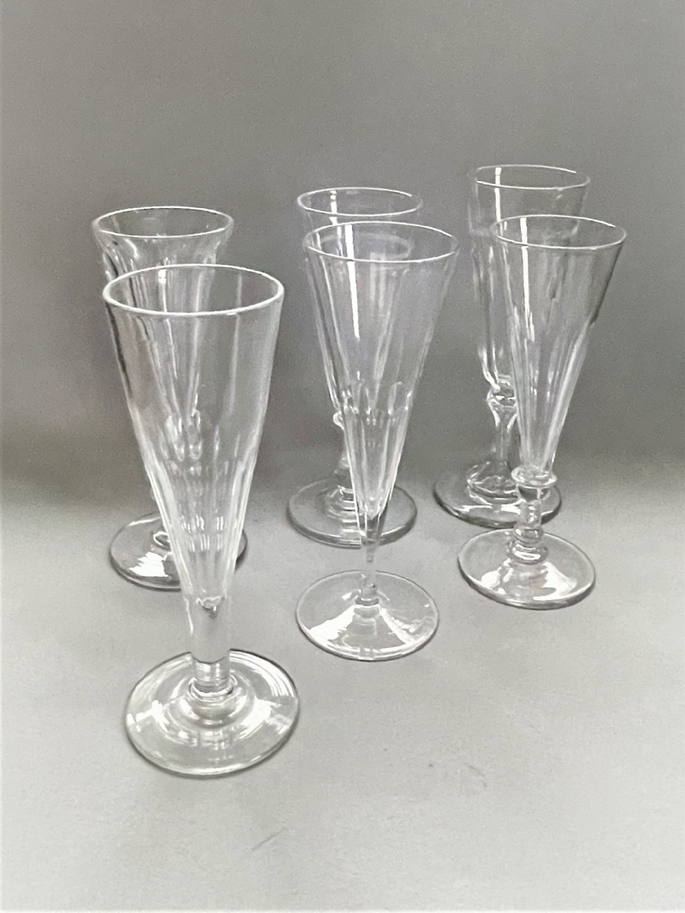 A harlequin set of 6 Victorian champagne flutes