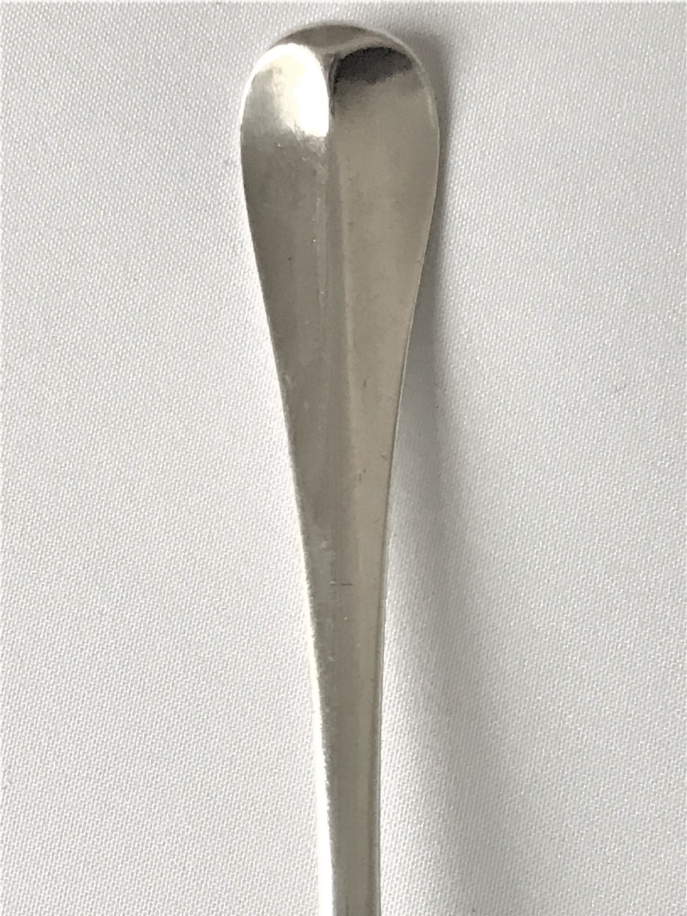 A fabulous Queen Anne silver table spoon View III