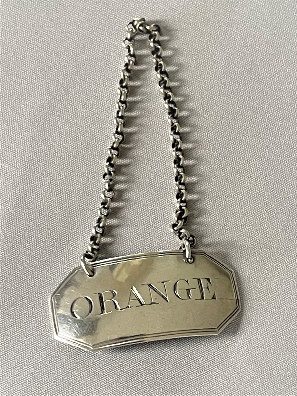 A lovely Georgian silver 'Orange' decanter label