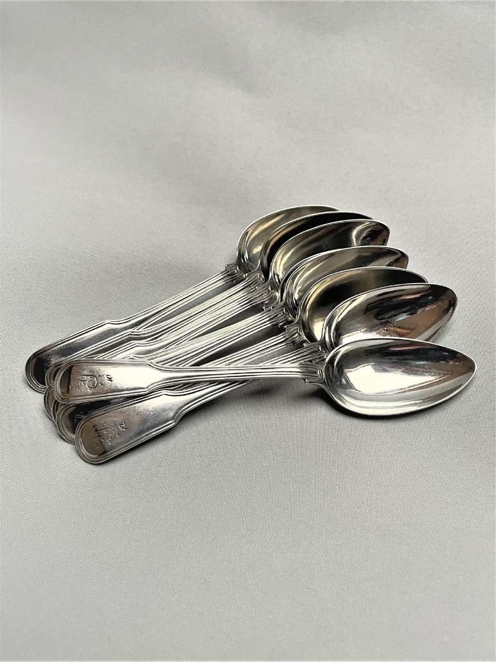 A set of 8 18th Century silver Fiddle & Thread pattern teaspoons