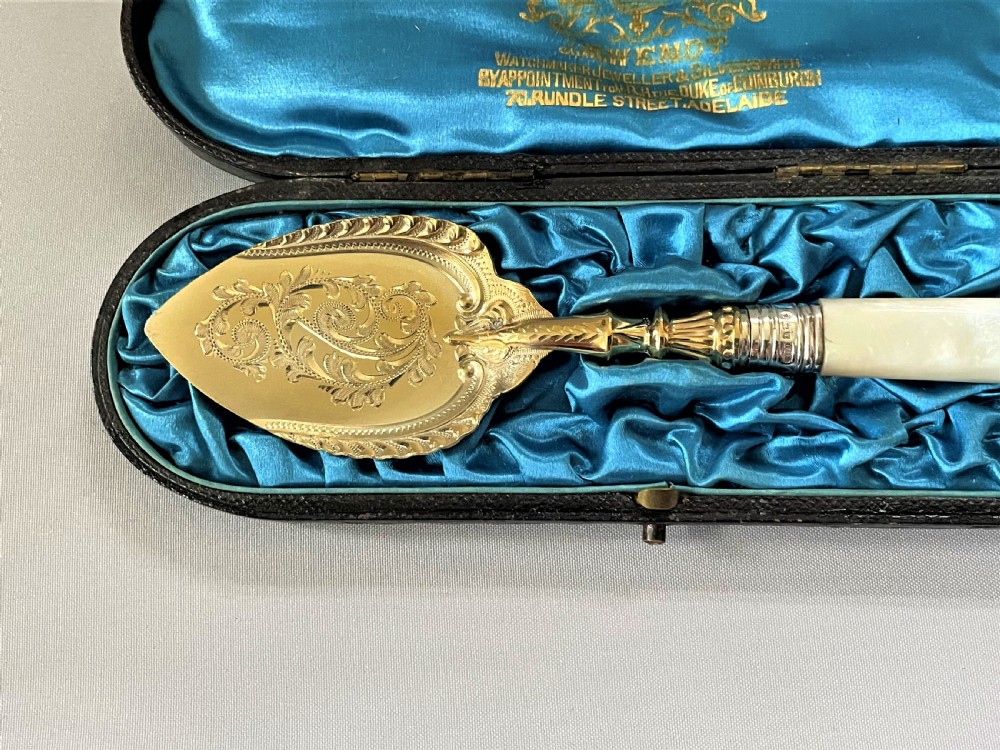 A superb Edwardian silver gilt preserve spoon View II
