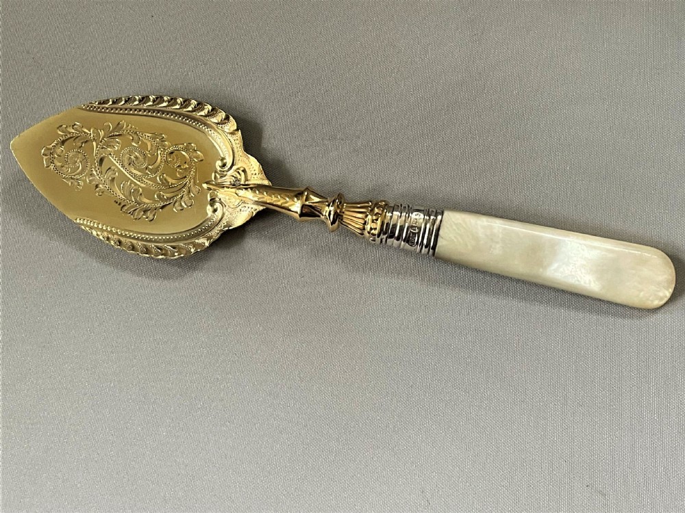 A superb Edwardian silver gilt preserve spoon View III