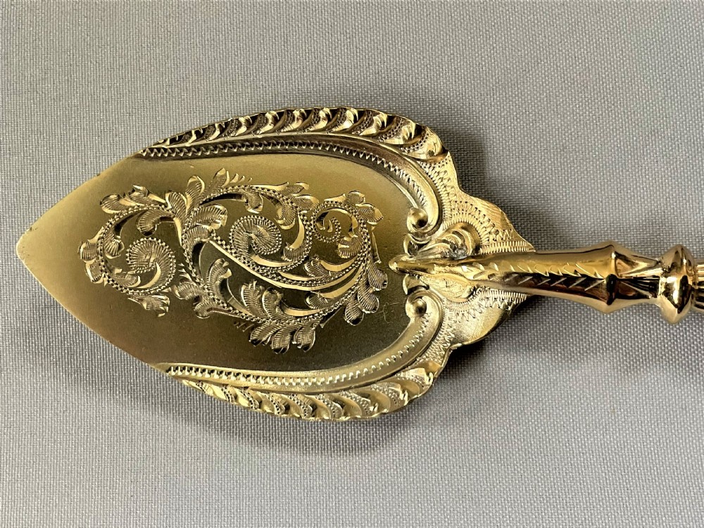 A superb Edwardian silver gilt preserve spoon View IV