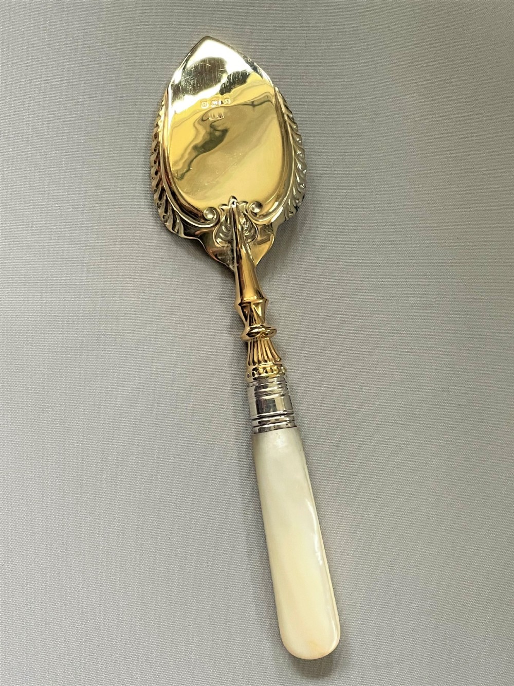 A superb Edwardian silver gilt preserve spoon View V