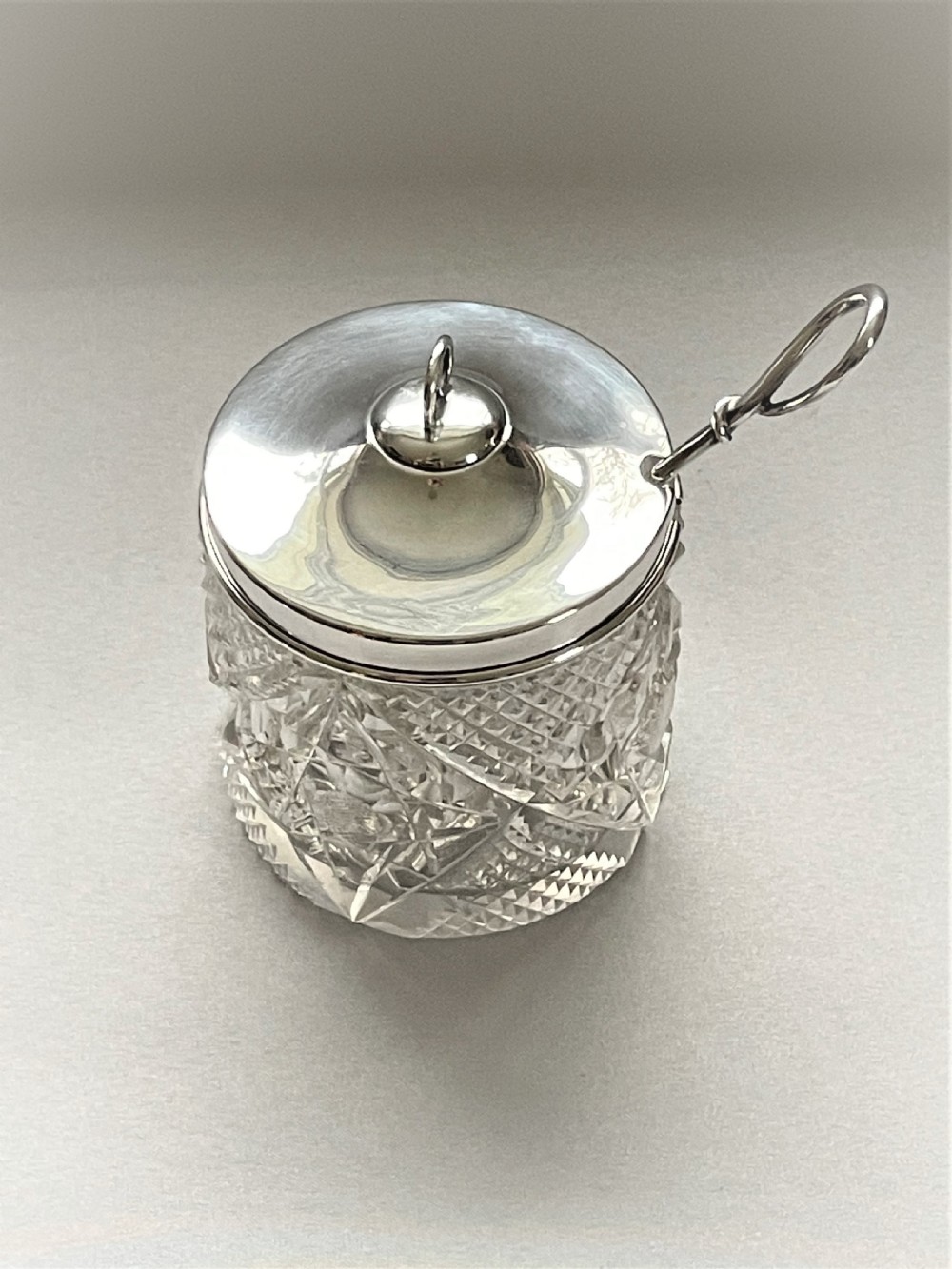 An Edwardian silver mounted cut glass preserve jar & spoon View III