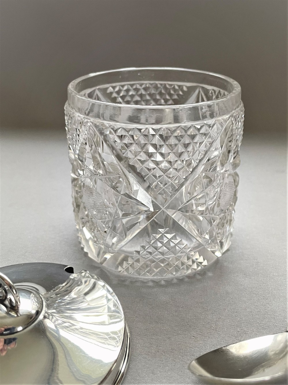 An Edwardian silver mounted cut glass preserve jar & spoon View IV