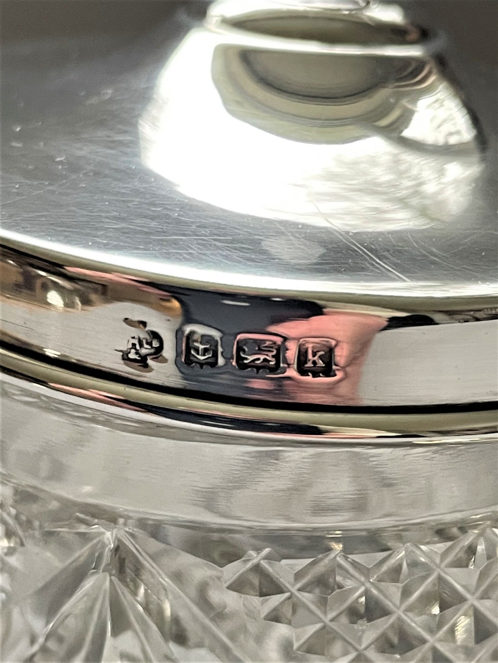 An Edwardian silver mounted cut glass preserve jar & spoon View V