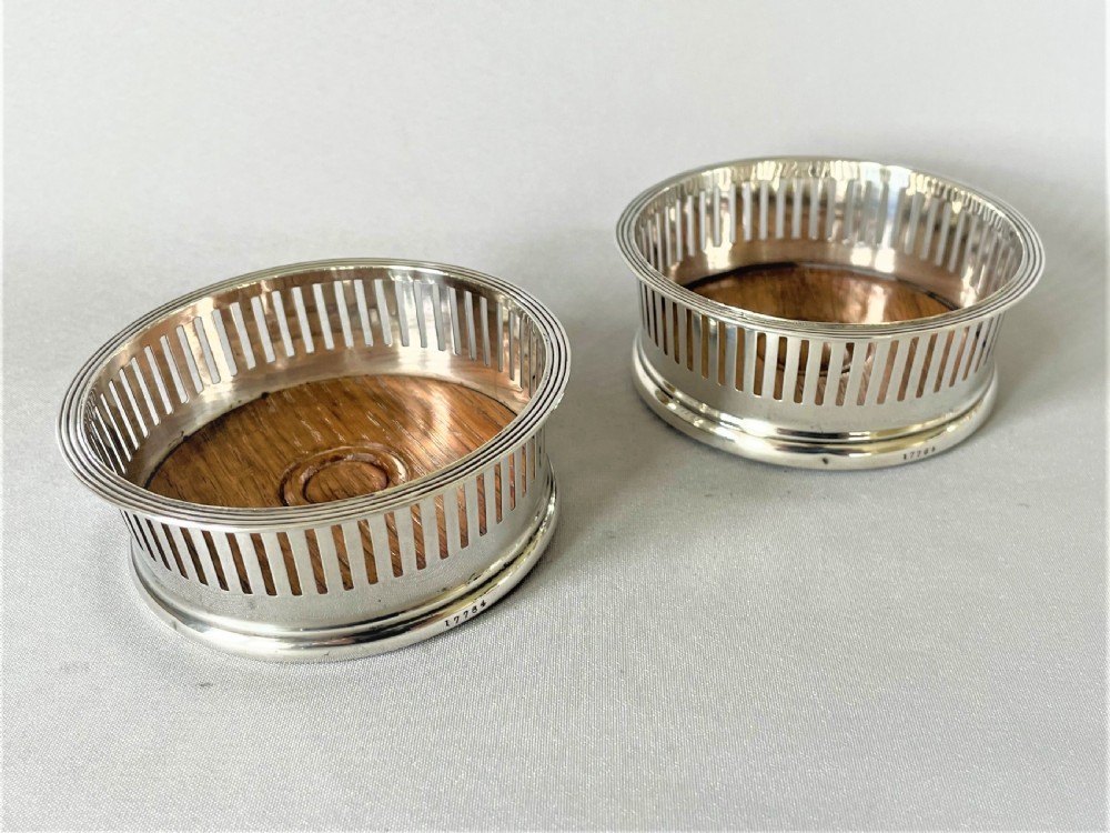 A Lovely Pair Of Asprey Small Silver Coasters