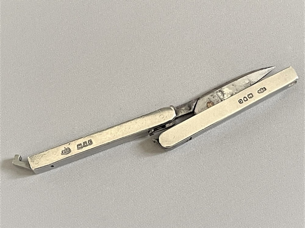 A pair of silver handled Victorian 'Campaign' folding scissors View V