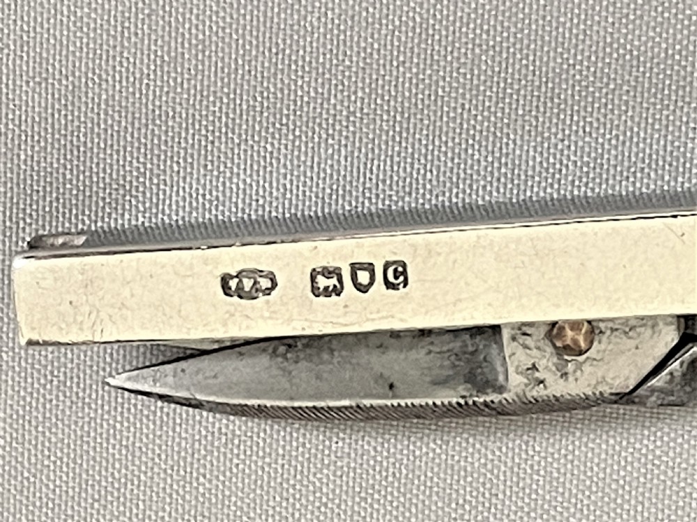 A pair of silver handled Victorian 'Campaign' folding scissors View VI