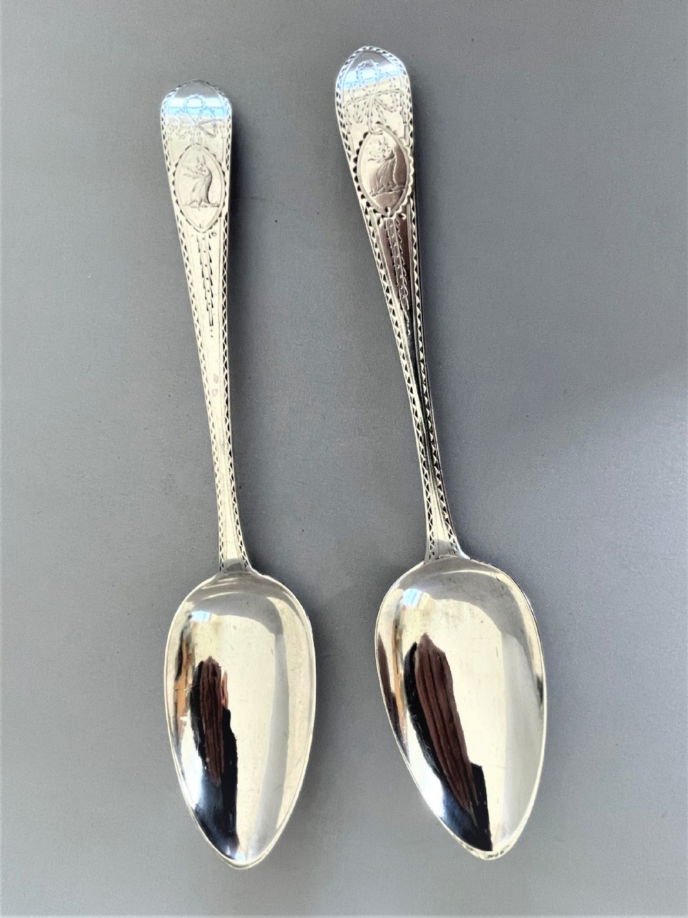 A superb pair of Irish bright cut silver serving spoons