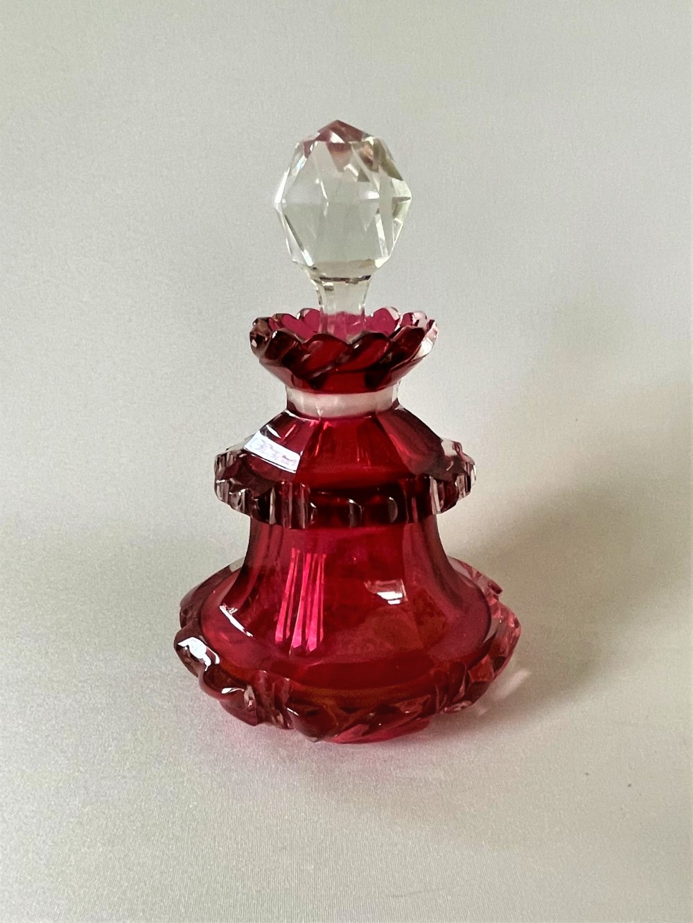 A Victorian gothic cranberry table cologne bottle