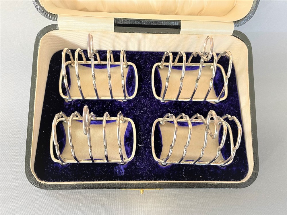 A gorgeous set of four silver breakfast toast racks View II
