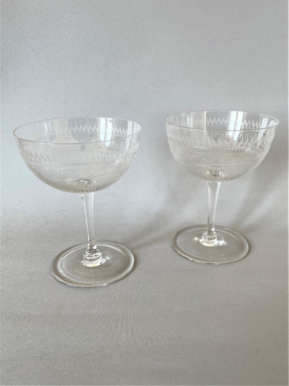 A gorgeous pair of Victorian etched champagne coupes 