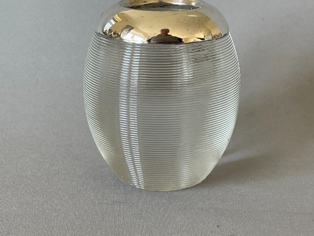 An unusual oval shaped & silver mounted match striker View II