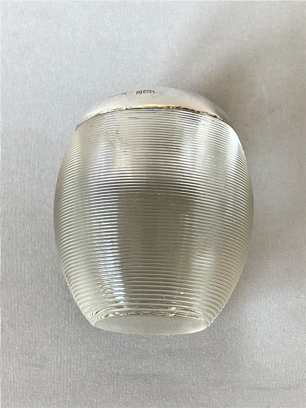 An unusual oval shaped & silver mounted match striker View III