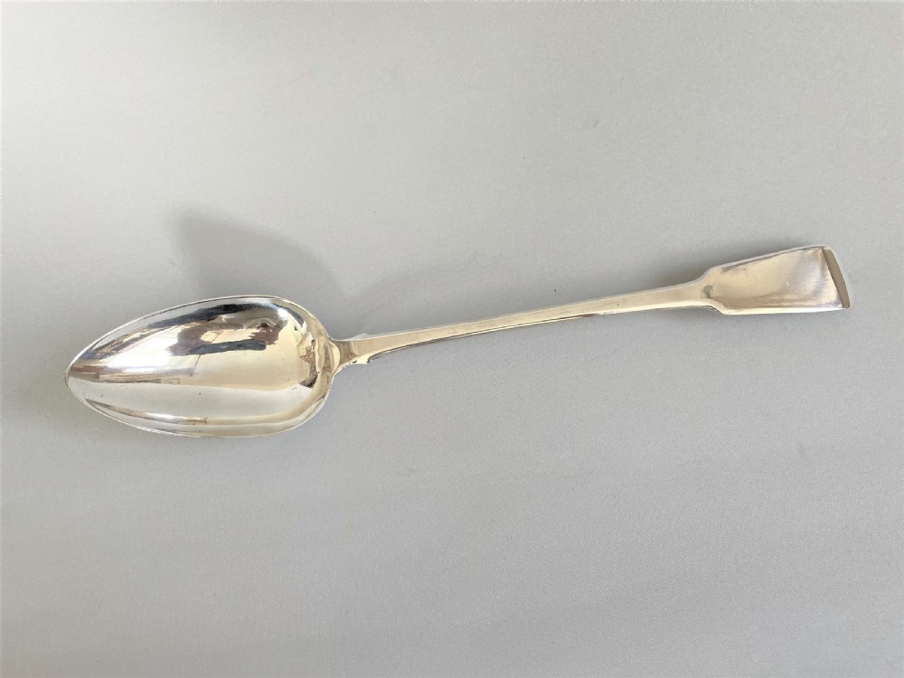 A handsome George IV silver stuffing spoon