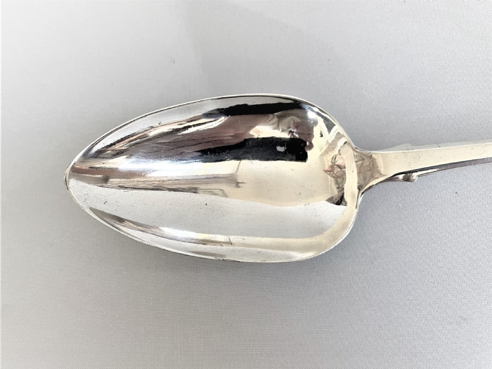 A handsome George IV silver stuffing spoon View II