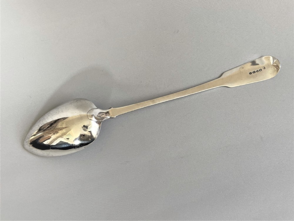 A handsome George IV silver stuffing spoon View III