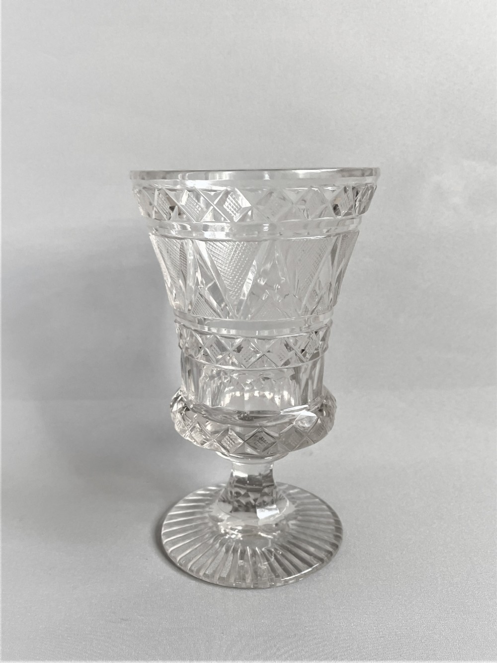An exquisite small cut glass celery vase