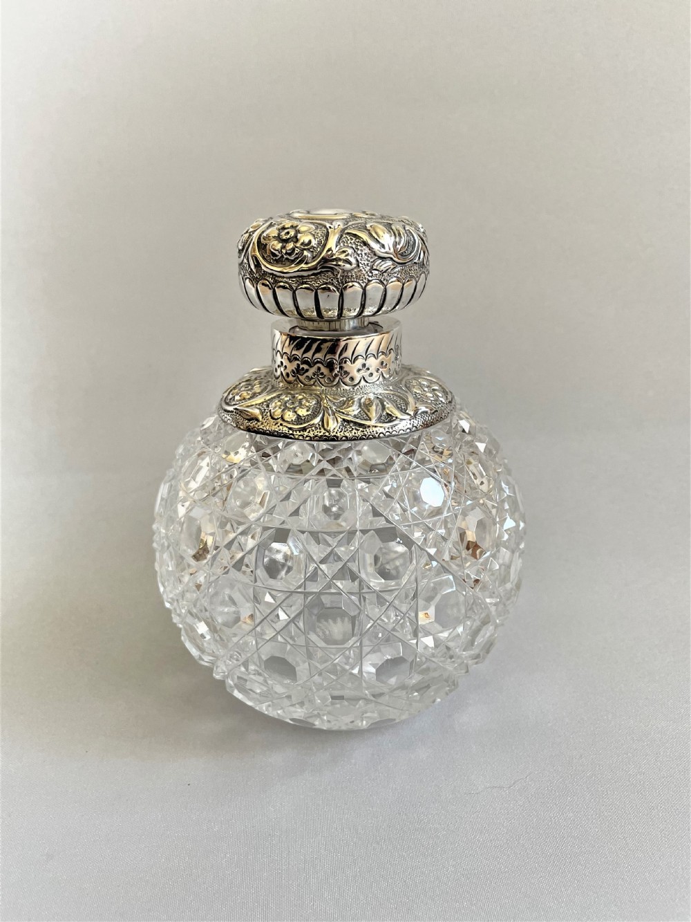 A fabulous Victorian silver mounted cologne bottle
