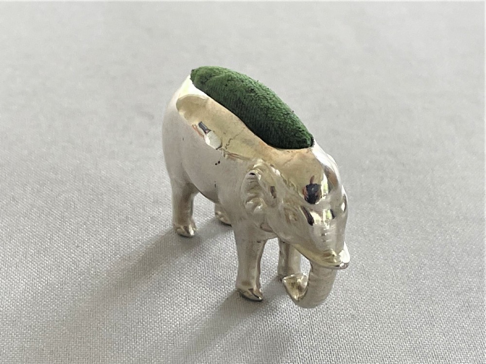 An Edwardian silver elephant pin cushion View III