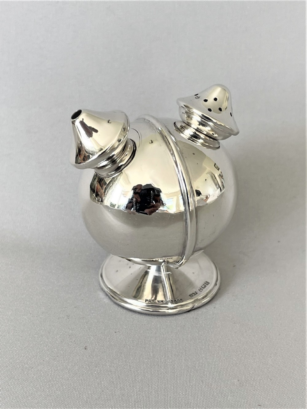 A charming novelty silver salt & pepper pot combo