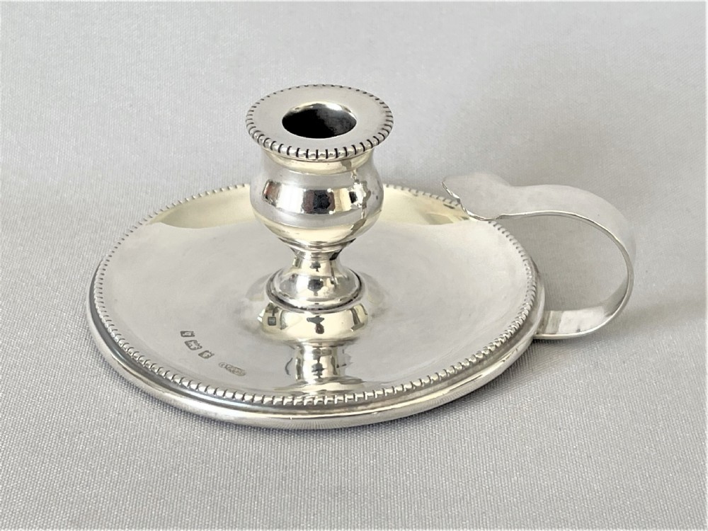A charming Edwardian Arts & Crafts silver chamber stick
