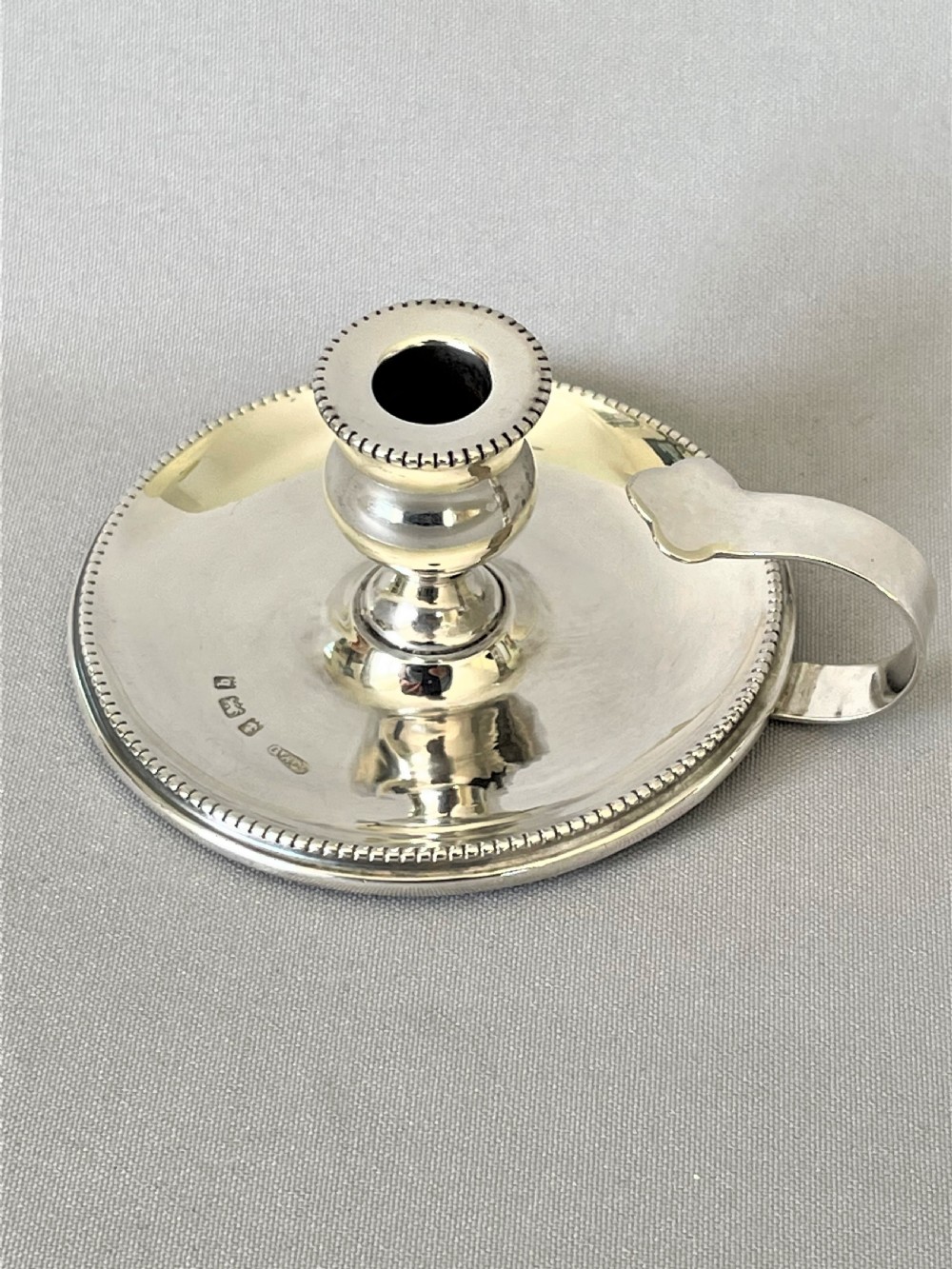 A charming Edwardian Arts & Crafts silver chamber stick View II