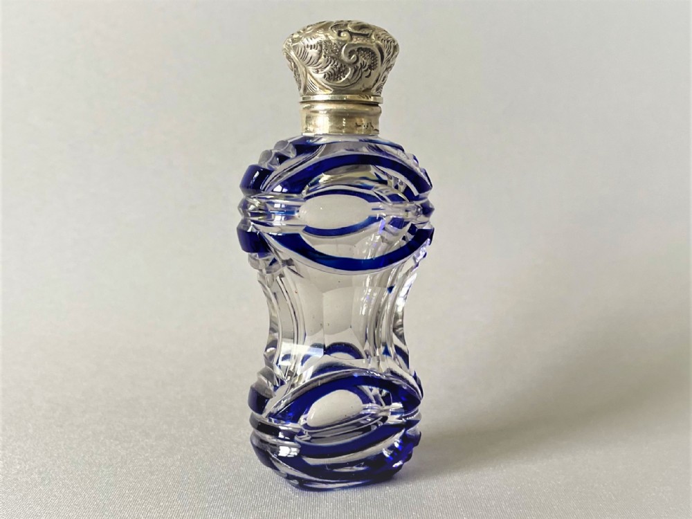 A gorgeous Victorian silver mounted scent bottle