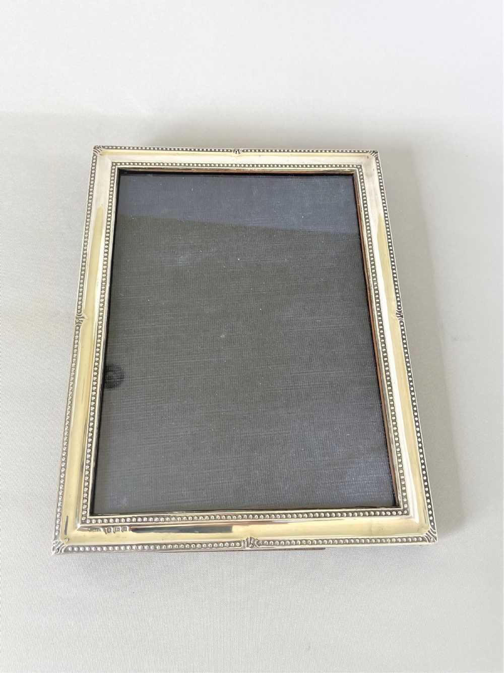 A fine George V silver photo frame with beaded edging View V