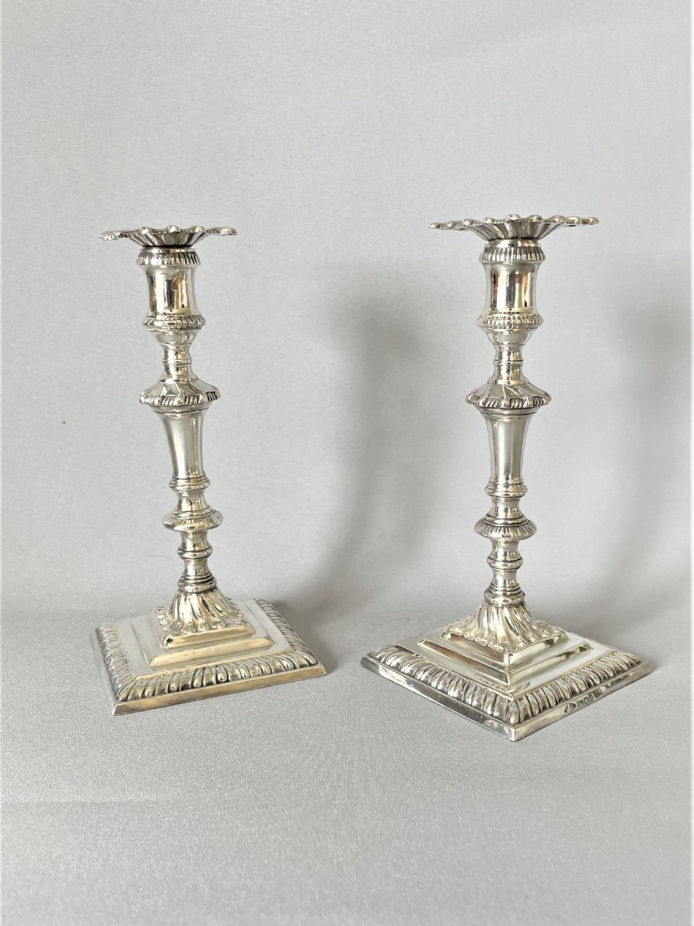 A superb pair of Edwardian silver candlesticks