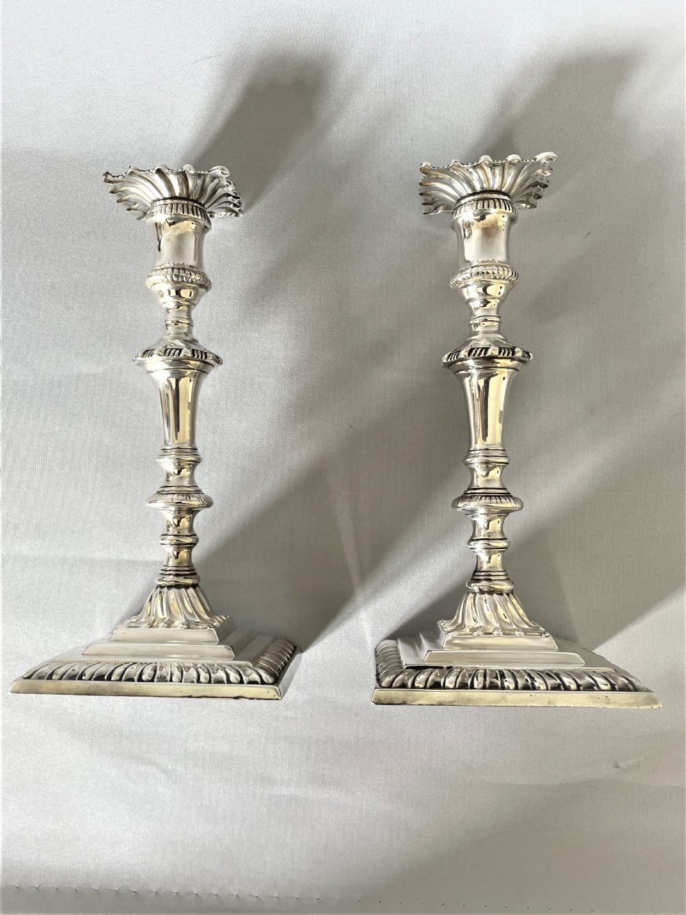A superb pair of Edwardian silver candlesticks View III
