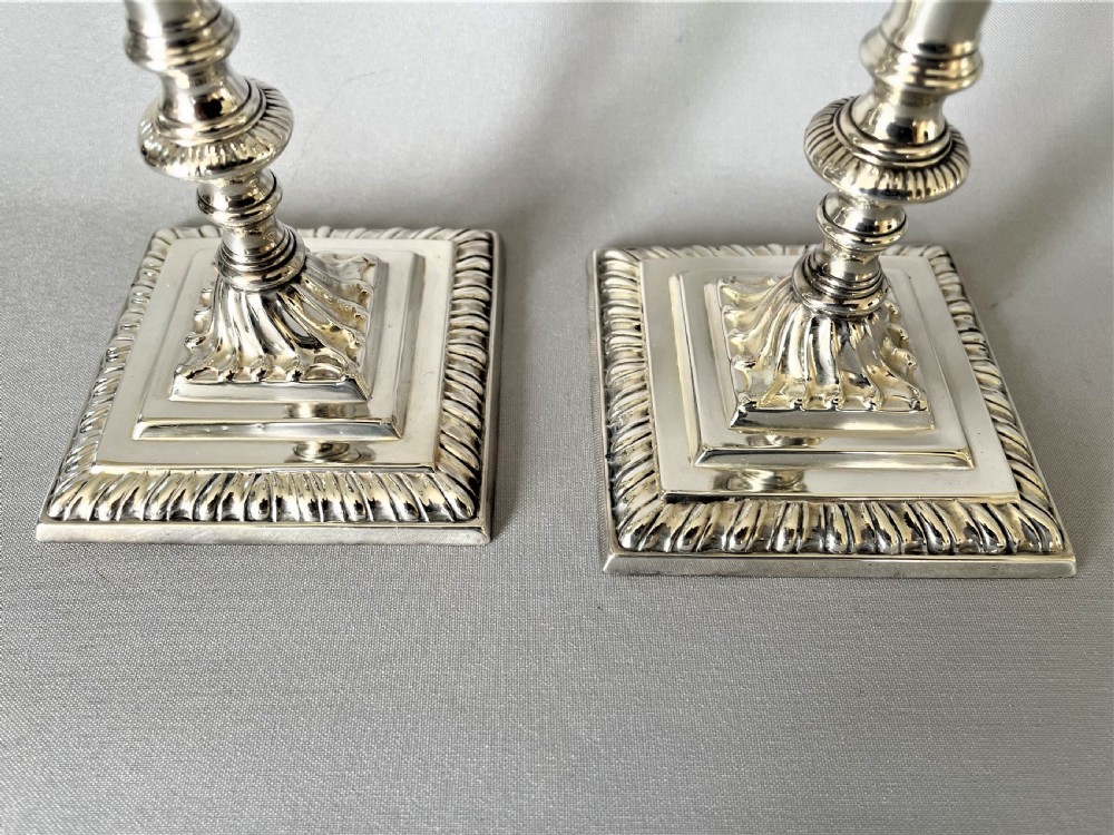 A superb pair of Edwardian silver candlesticks View IV