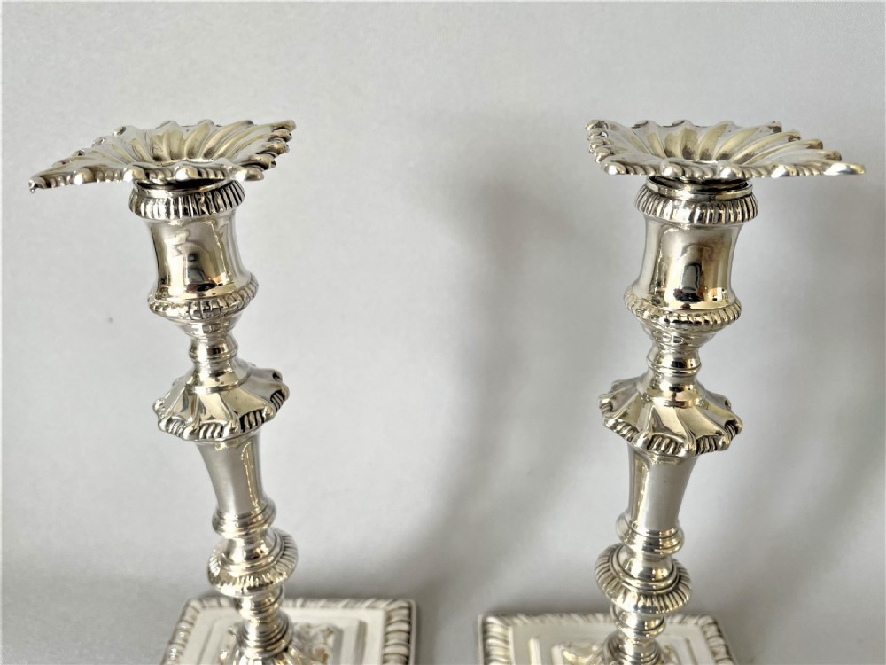 A superb pair of Edwardian silver candlesticks View V