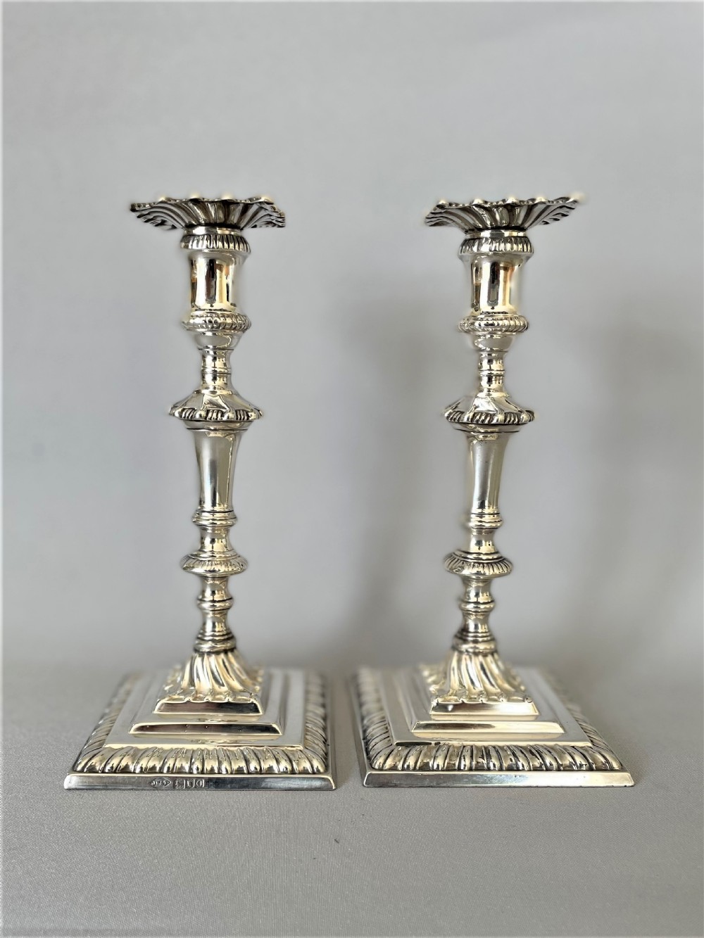 A superb pair of Edwardian silver candlesticks View X