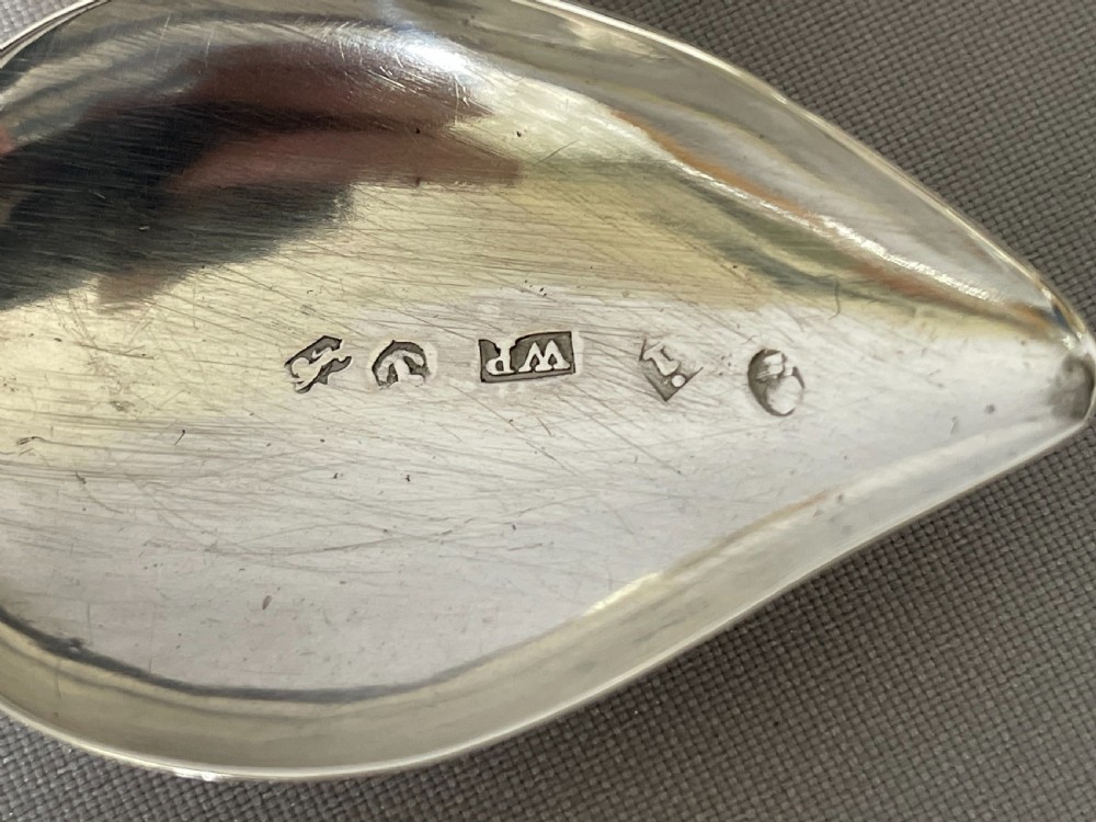 A delightful Georgian silver leaf caddy spoon View III