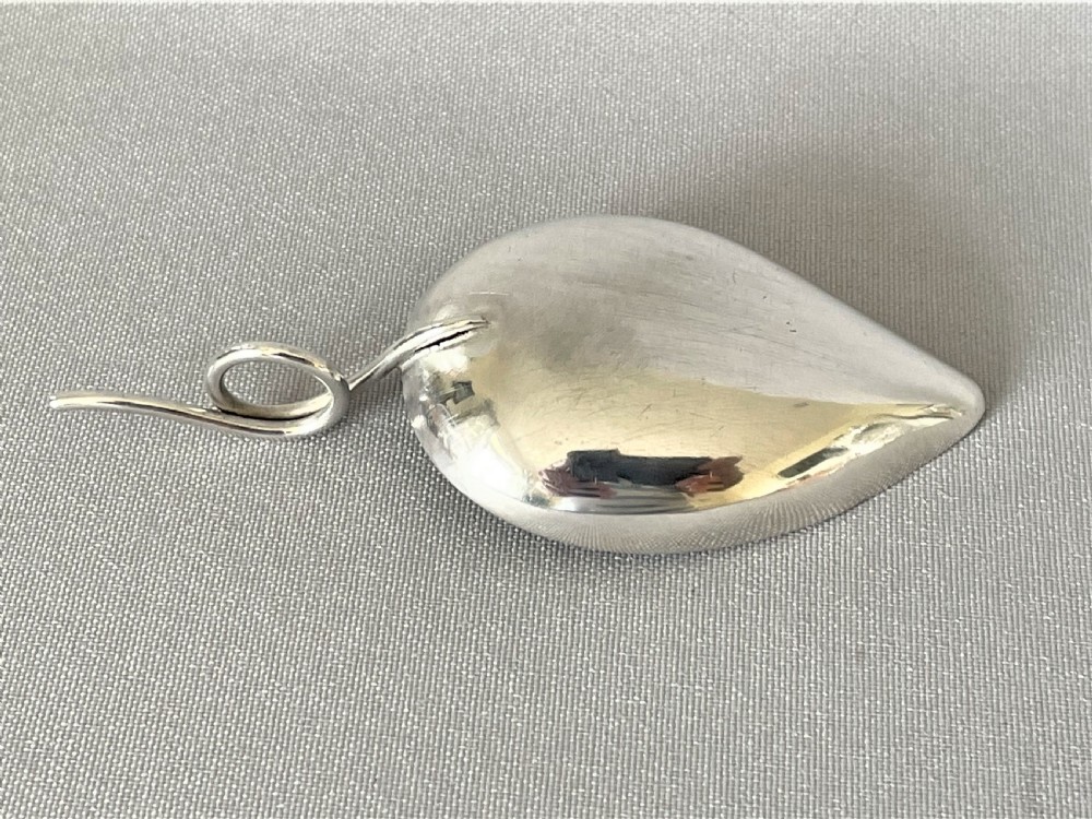 A delightful Georgian silver leaf caddy spoon View IV