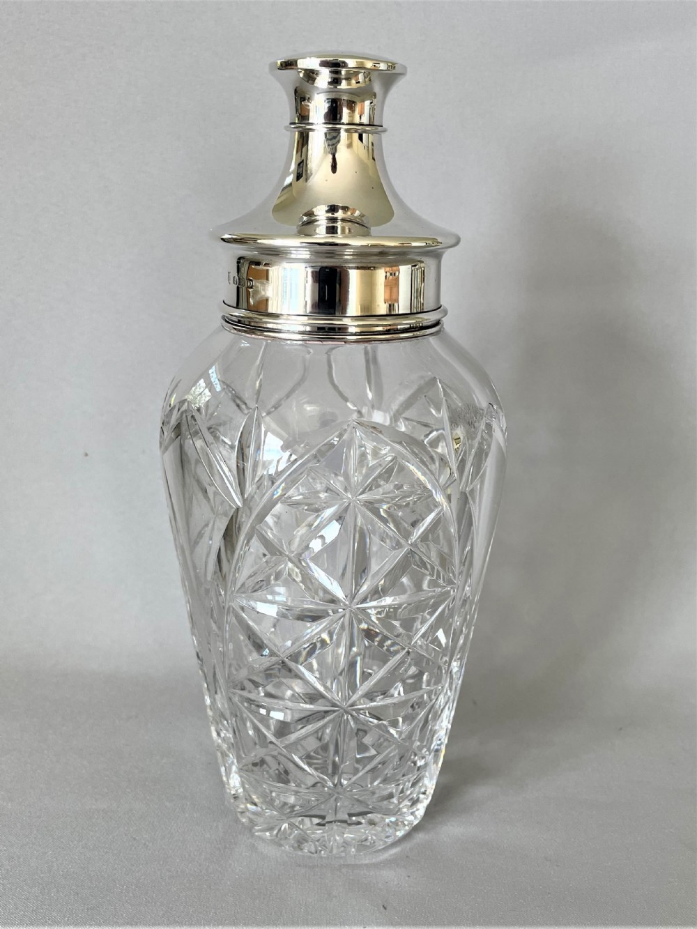 A superb hallmarked silver & cut glass cocktail shaker