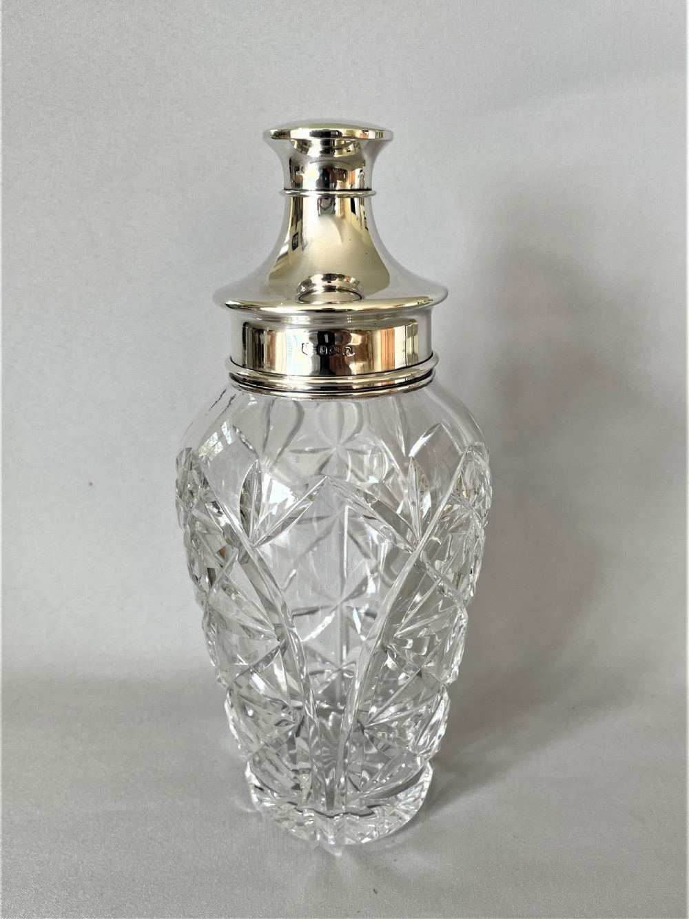 A superb hallmarked silver & cut glass cocktail shaker View V