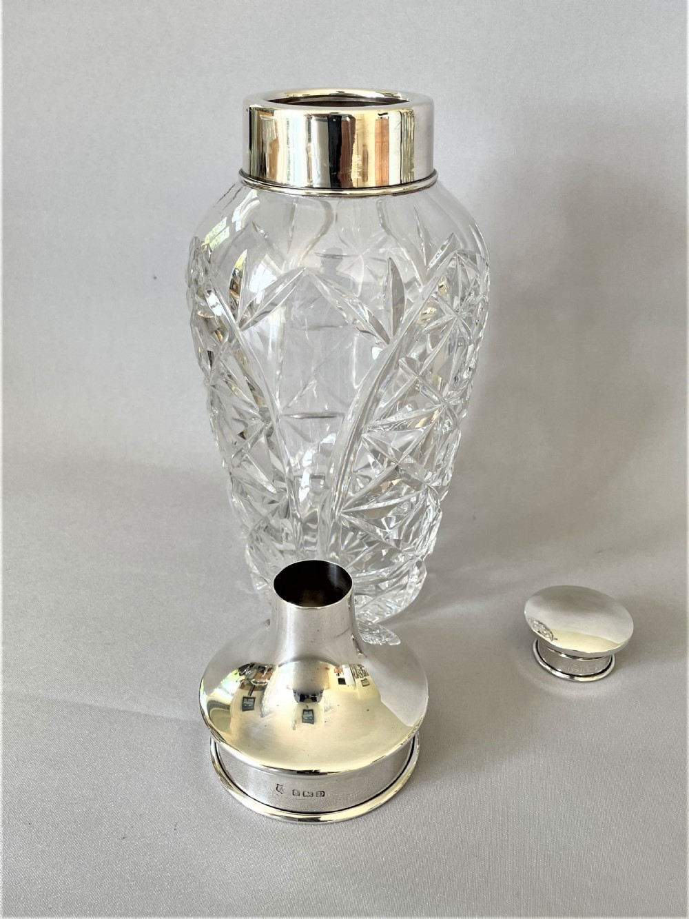 A superb hallmarked silver & cut glass cocktail shaker View VII