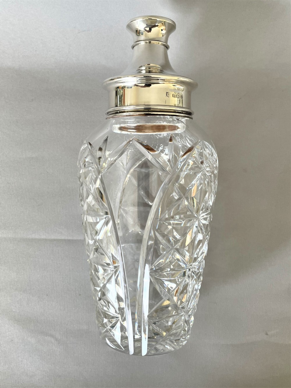 A superb hallmarked silver & cut glass cocktail shaker View XII
